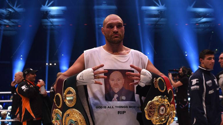 British Tyson Fury celebrates after the WBA, IBF, WBO and IBO title bout against Ukrainian world heavyweight boxing champion Wladimir Klitschko