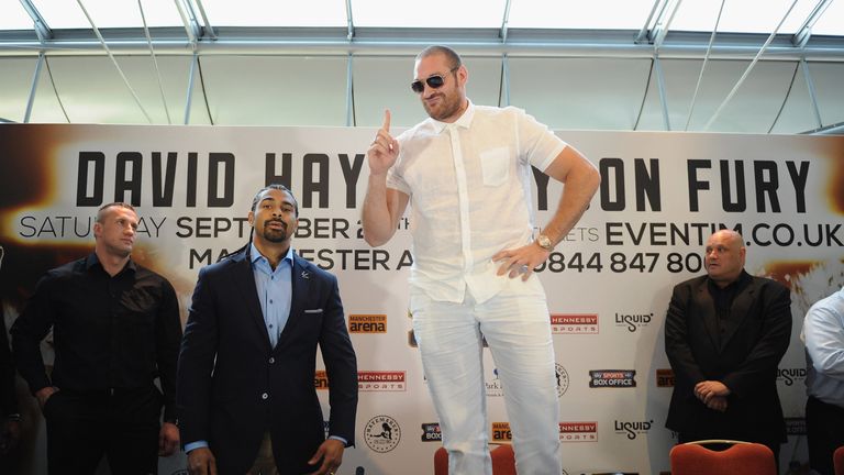 British heavyweight boxers Tyson Fury (C) and David Haye (2nd L) attend a press conference to announce their upcoming title fig