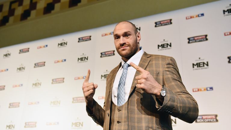 Tyson Fury reacts during a press conference