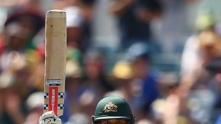 PERTH, AUSTRALIA - NOVEMBER 13: Usman Khawaja of Australia celebrates after reaching his half century during day one of the second Test match between Austr