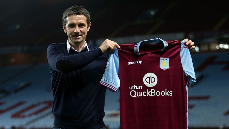 New Aston Villa manager Remi Garde poses with a club shirt after the press conference at Villa Park, Birmingham