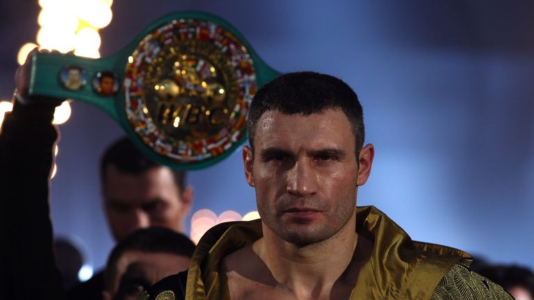 Vitali Klitschko of Ukraine exchanges punches with Dereck Chisora