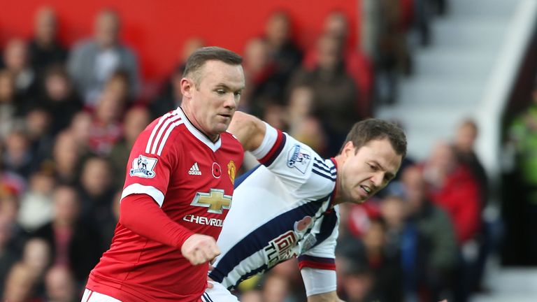 Wayne Rooney of Manchester United in action with Jonny Evans of West Bromwich Albion