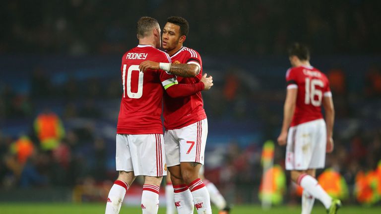 Wayne Rooney and Memphis Depay of Manchester United embrace at the final whistle during the UEFA Champions League Group match v CSKA Moscow