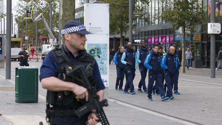 Players and staff of the France football team go for a morning walk-about escorted by British armed police around Wembley Stadium