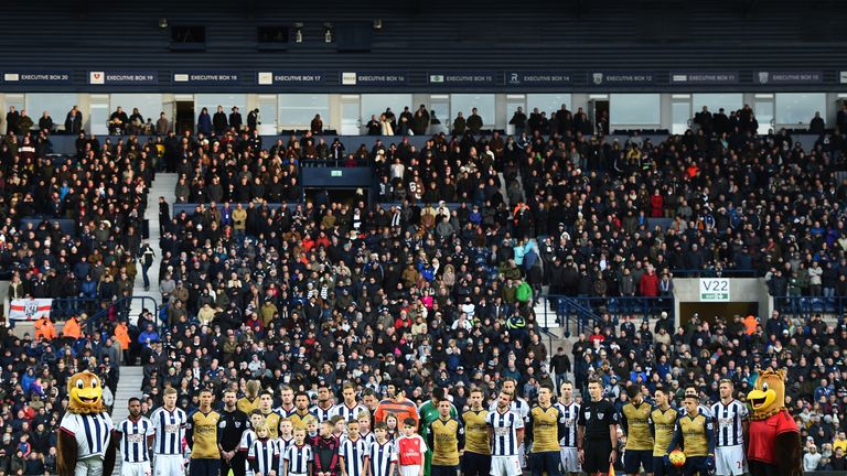 Players from West Brom and Arsenal line up for the French national anthem at The Hawthorns