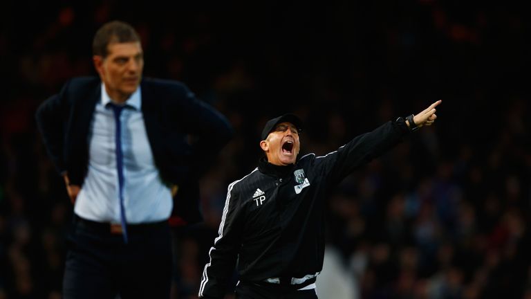 West Brom manager Tony Pulis (right) shouts instructions as West Ham boss Slaven Bilic looks on