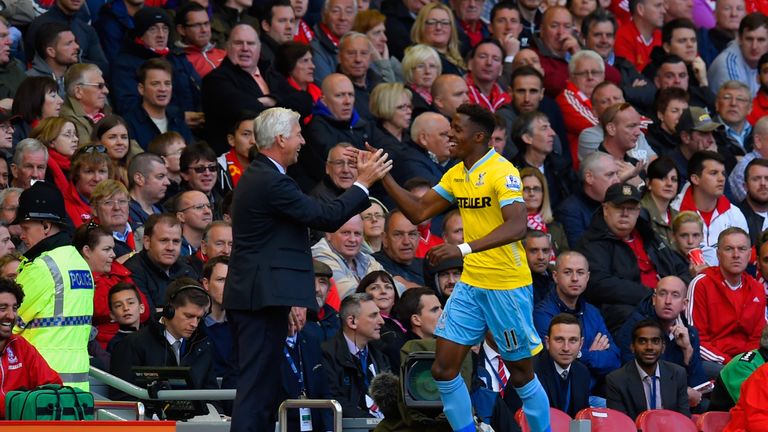 Manager Alan Pardew of Crystal Palace congratulates Wilfried Zaha of Crystal Palace on scoring their second goal during the Premier League game in May 2015