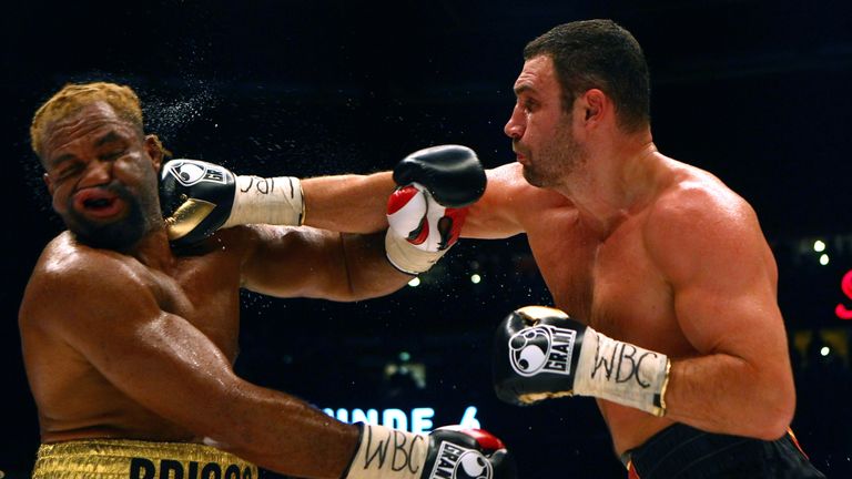 Shannon Briggs of USA (L) exchanges punches with Vitali Klitschko (R)