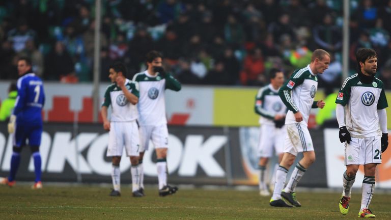 Wolfsburg players look deflated during their 3-0 Bundesliga defeat to Borussia Dortmund in January 2011