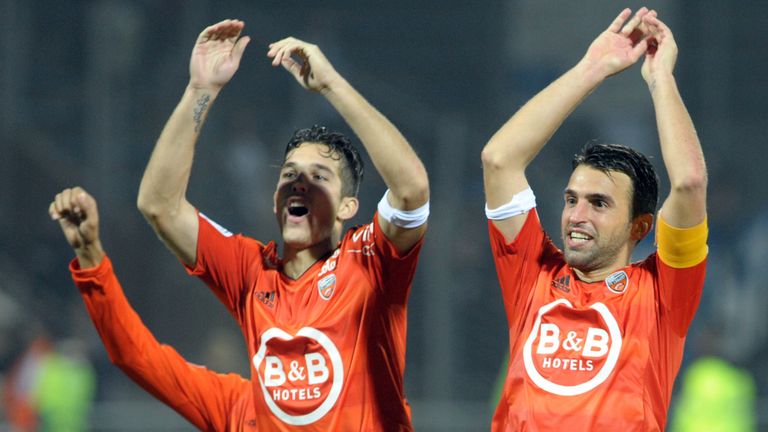 Lorient's French midfielder Yann Jouffre (R) reacts after Lorient won the French L1 football match Lorient vs Troyes on November 7, 2015