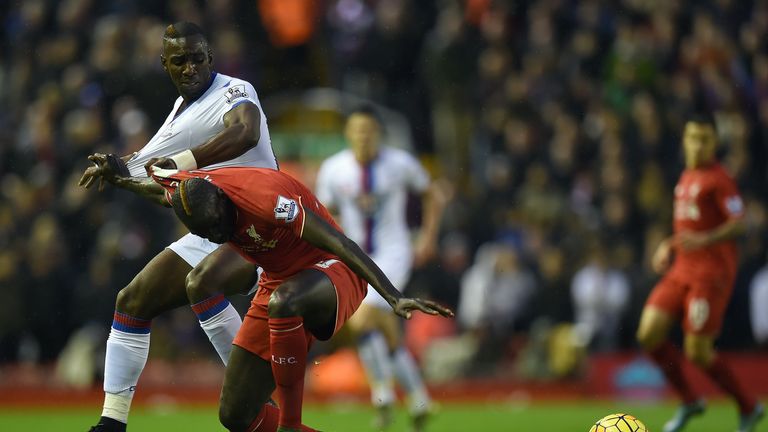 Crystal Palace's Yannick Bolasie (L) vies with Liverpool defender Mamadou Sakho