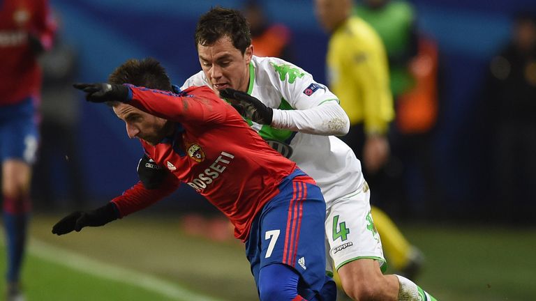 Zoran Tosic (L) of PFC CSKA Moscow challenged by Marcel Schafer of VfL Wolfsburg