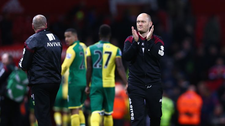 MANCHESTER, ENGLAND - DECEMBER 19:  Alex Neil Manager of Norwich City applauds supporters after his team's 2-1 win in the Barclays Premier League match bet