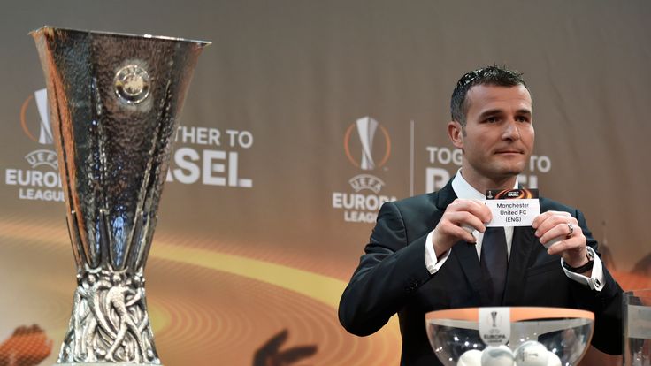 UEFA Europa League final ambassador Alexander Frei shows the name of Manchester United during the draw for  the round of 16, Nyon