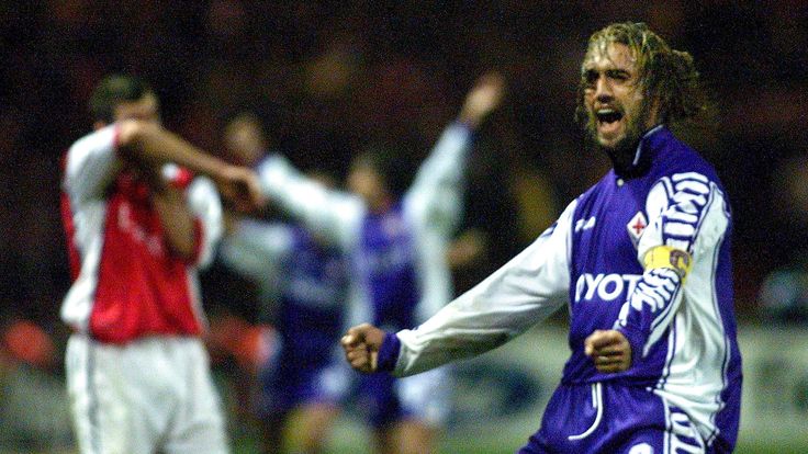 Fiorentina's Gabriel Batistuta celebrates while Arsenal's Nigel Winterburn wipes his head. Arsenal 0-1 Fiorentina, Wembley in October 1999.