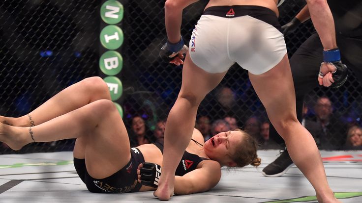 Ronda Rousey of the US (L) goes down after being knocked out by compatriot Holly Holm