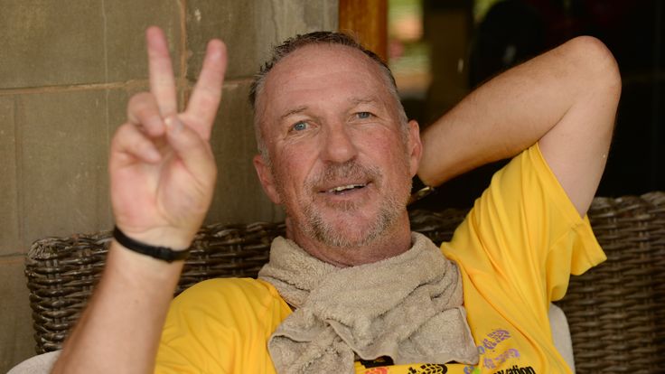 PRETORIA, SOUTH AFRICA - DECEMBER 17:  In this handout image provided by Philip Brown, Sir Ian Botham rests after completing the 'Beefy Walking the Rainbow