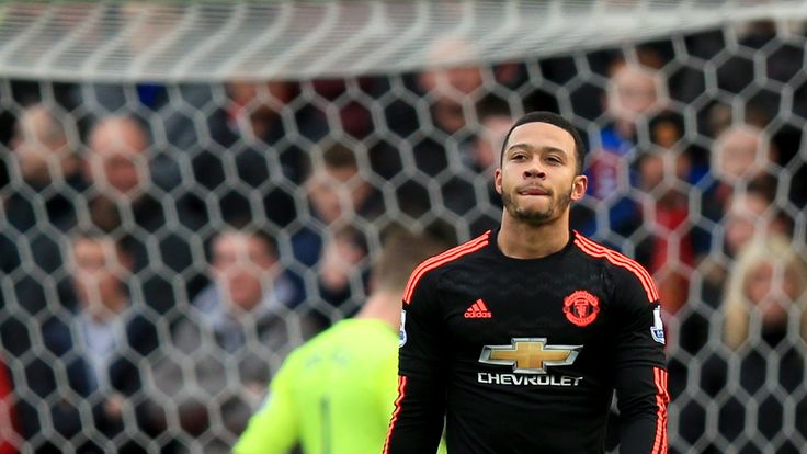 Manchester United's Memphis Depay dejected after Stoke City score their first goal during the Premier League match at the Britannia Stadium