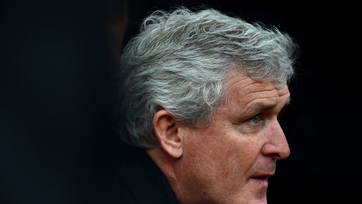 Stoke manager Mark Hughes waits for kick-off against Manchester United