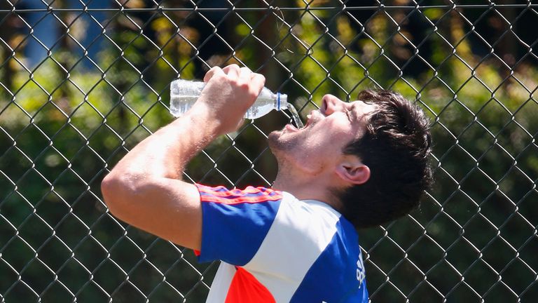 Alastair Cook enjoys a drink during England nets