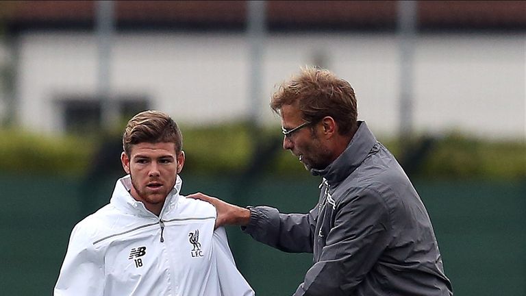 Liverpool manager Jurgen Klopp makes a point to Alberto Moreno during a Liverpool training session at Melwood Training Gro