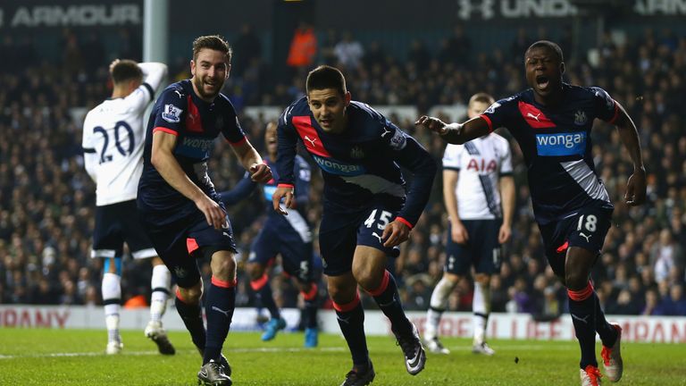 Aleksandar Mitrovic of Newcastle United (C) celebrates with Paul Dummett and Chancel Mbemba as he scores their equaliser at Tottenham, Premier League