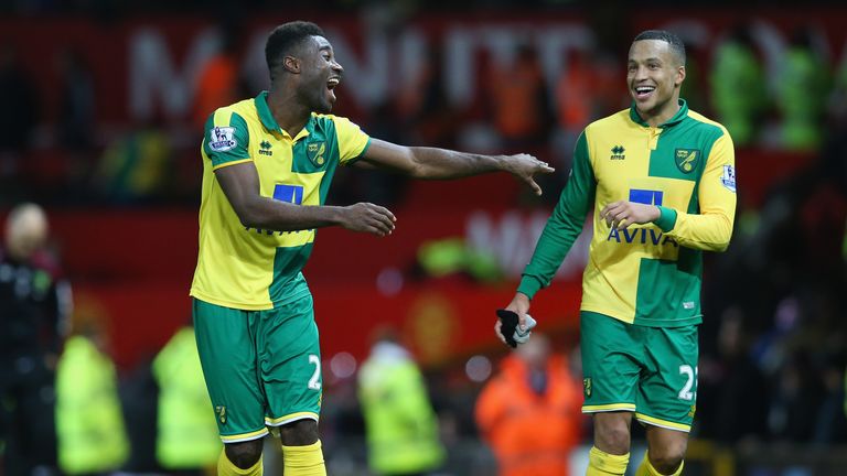 Alexander Tettey and Martin Olsson of Norwich City celebrate their team's 2-1 win at Manchester United