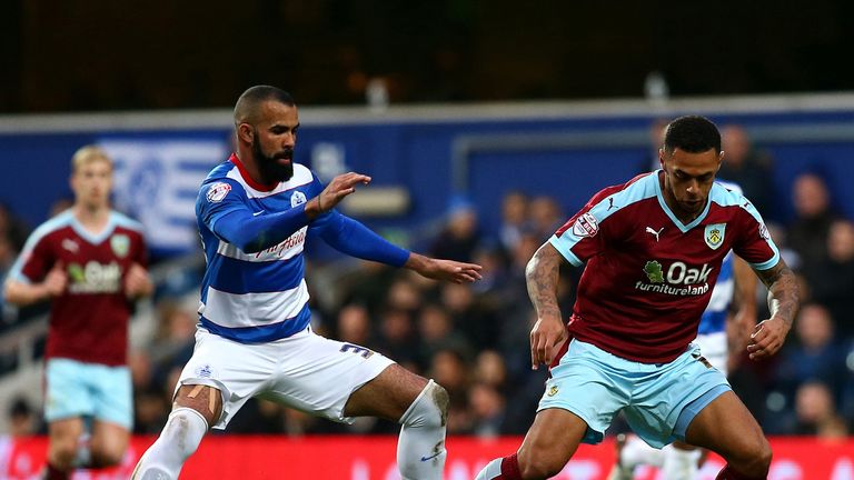 Andre Gray keeps the ball away from Sandro