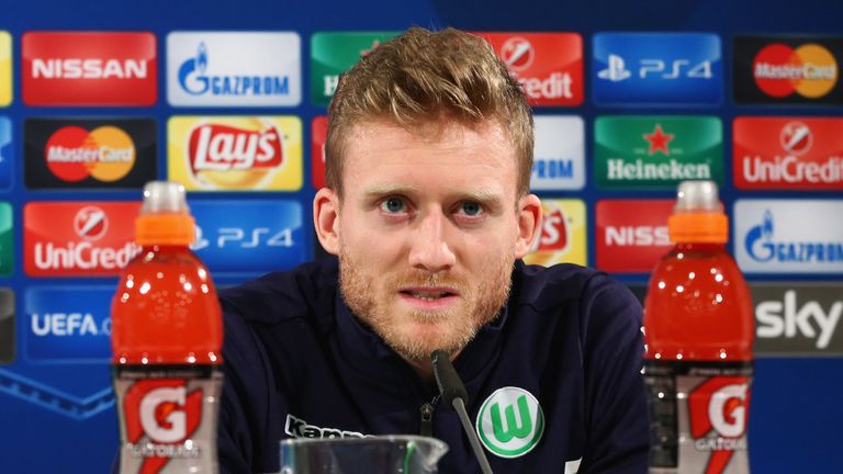 Wolfsburg's Andre Schurrle speaks during a press conference ahead of the Tuesday's Champions League match against Manchester United 