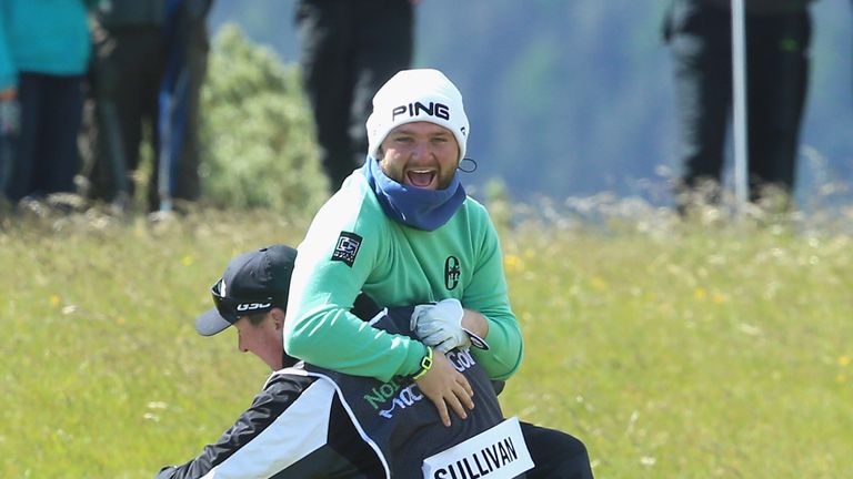 Andy Sullivan of England celebrates an albatross on the 1st hole with his caddie during the Second Round of the Dubai Duty Free Irish Open