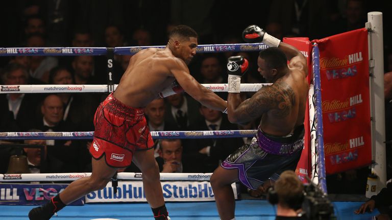 British boxer Anthony Joshua (L) vies against British boxer Dillian Whyte