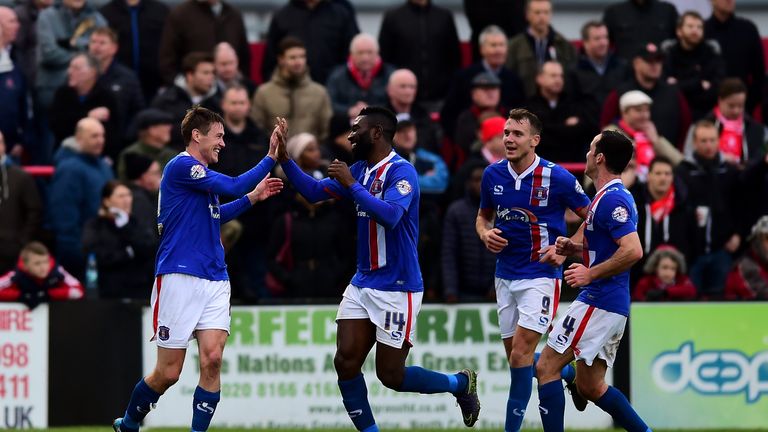 Anthony Sweeney of Carlisle United (L) celebrates with his team mates after scoring their second goal against Welling