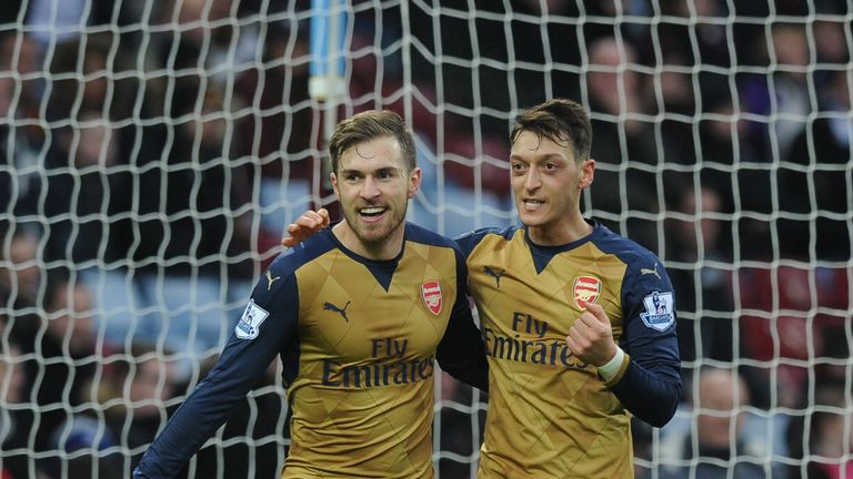 Aaron Ramsey celebrates scoring the 2nd Arsenal goal with (R) Mesut Ozil  during the Barclays Premier League match between Aston Villa and Arsenal