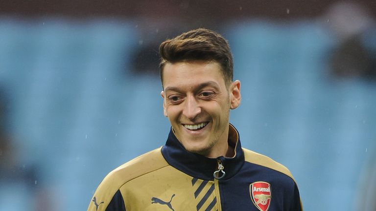 Mesut Ozil of Arsenal warms up before the Barclays Premier League match between Aston Villa 