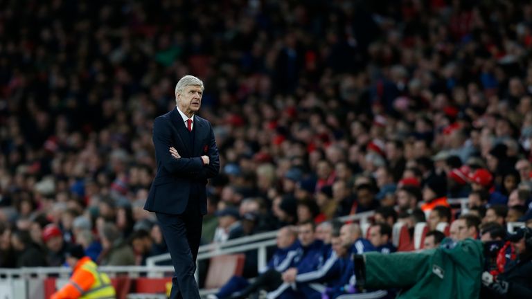 Arsene Wenger walks along the pitch during of the English Premier League football match between Arsenal and Sunderland
