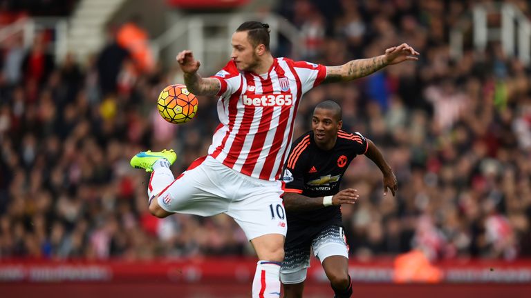 Ashley Young of Manchester United chases Marko Arnautovic of Stoke City as he controls the ball during the Premier League match at the Britannia Stadium