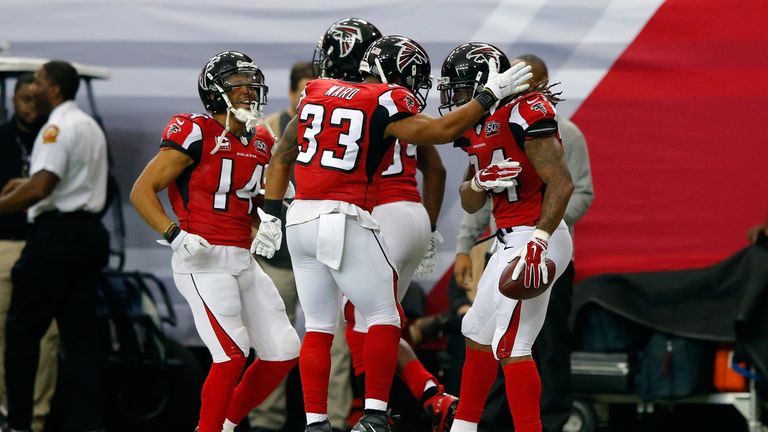 The Falcons celebrate a touchdown during their upset of the Panthers