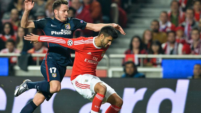 Atletico Madrid's Saul Niguez (left) vies with Benfica's Lisandro Lopez 