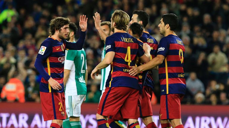 Barcelona celebrate after an own goal from Real Betis