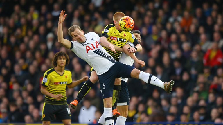 Watford's Ben Watson (C) competes for the ball against Harry Kane (L) and Erik Lamela (R) of Tottenham Hotspur