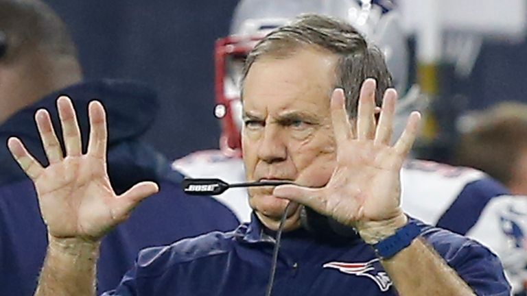 HOUSTON, TX - DECEMBER 13: Head coach Bill Belichick of the New England Patriots  sends in a signal while the Patriots play the Houston Texans in the third