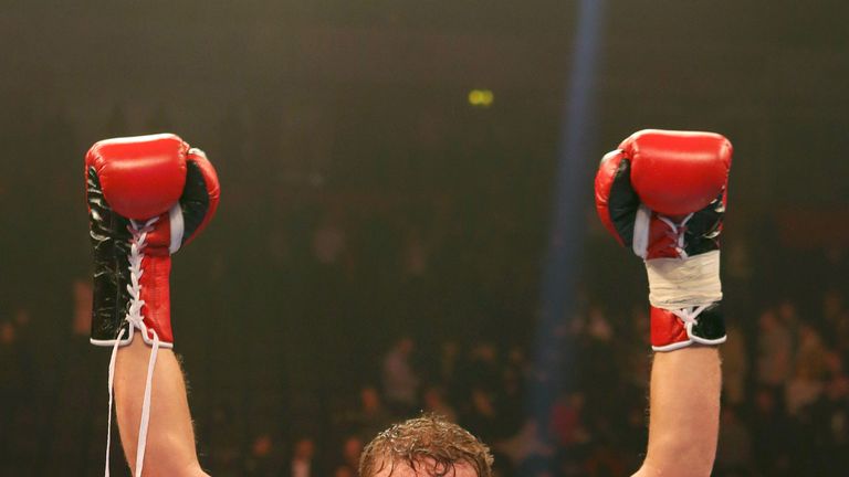 Saunders celebrates after claiming the WBO middleweight belt