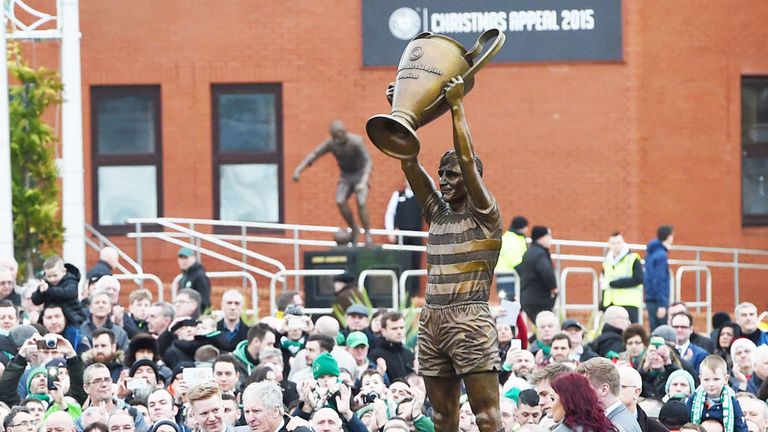 Billy McNeill standing nearest on the left to his statue at Celtic Park
