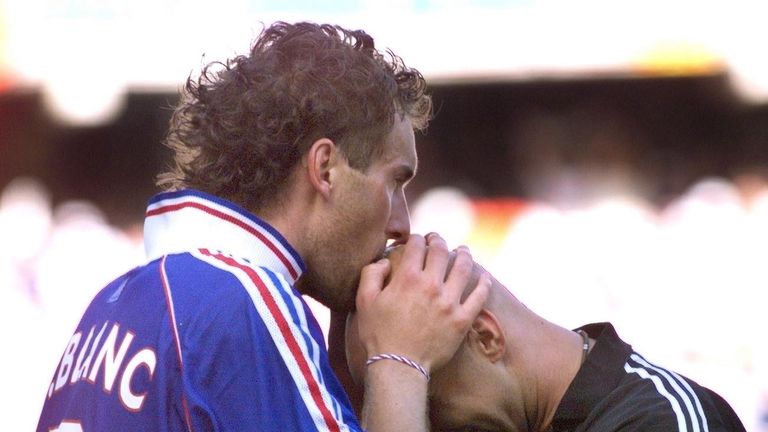 French defender Laurent Blanc (L) kisses French goalkeeper Fabien Barthez