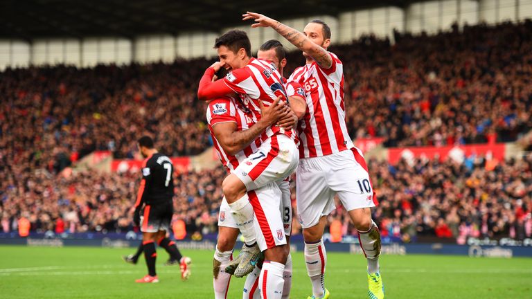 Bojan Krkic of Stoke City celebrates with team-mates after scoring the opening goal against Manchester United