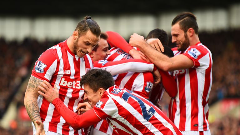 Bojan Krkic of Stoke City celebrates with team-mates after scoring the opening goal against Manchester United