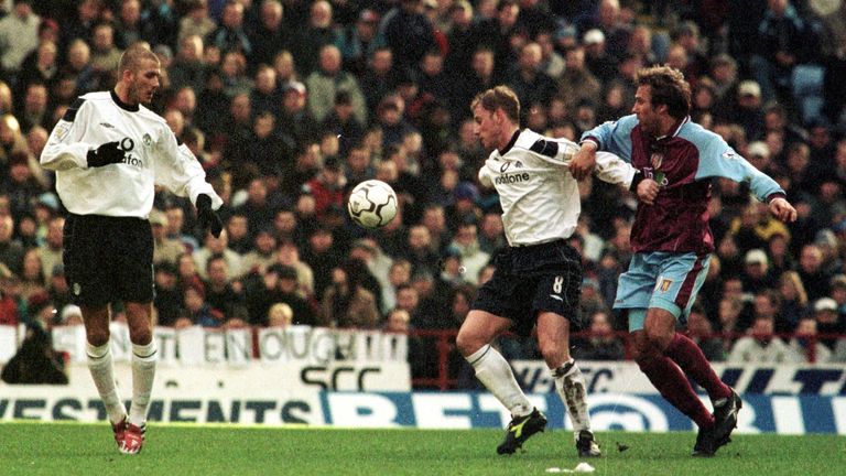 Manchester United's Nicky Butt (second right) pulls the shirt of Aston Villa's Paul Merson during United's 1-0 victory on Boxing Day in 2000