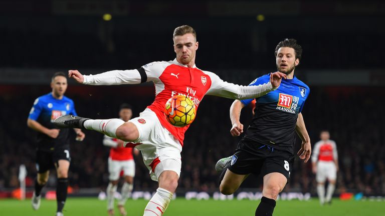 Calum Chambers of Arsenal and Harry Arter of Bournemouth compete for the ball at the Emirates 