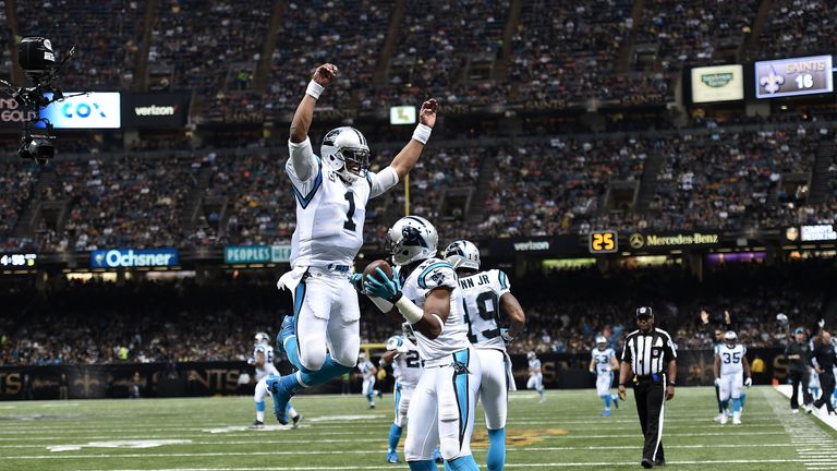 Cam Newton celebrates a touchdown with Devin Funchess 